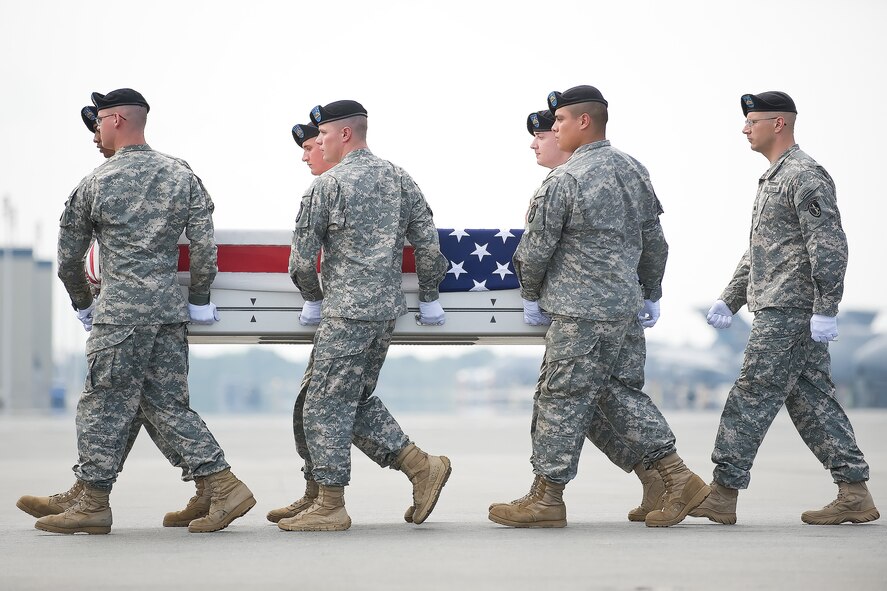 A U.S. Army carry team transfers the remains of Army 1st Lt. Dimitri A. Del Castillo, of Houston, Texas, at Dover Air Force Base, Del., June 27, 2011. Dimitri was assigned to Company B, 2nd Battalion, 35th Infantry, 3BCT, Schofield Barracks, Hawaii. (U.S. Air Force photo/Adrian Rowan)
