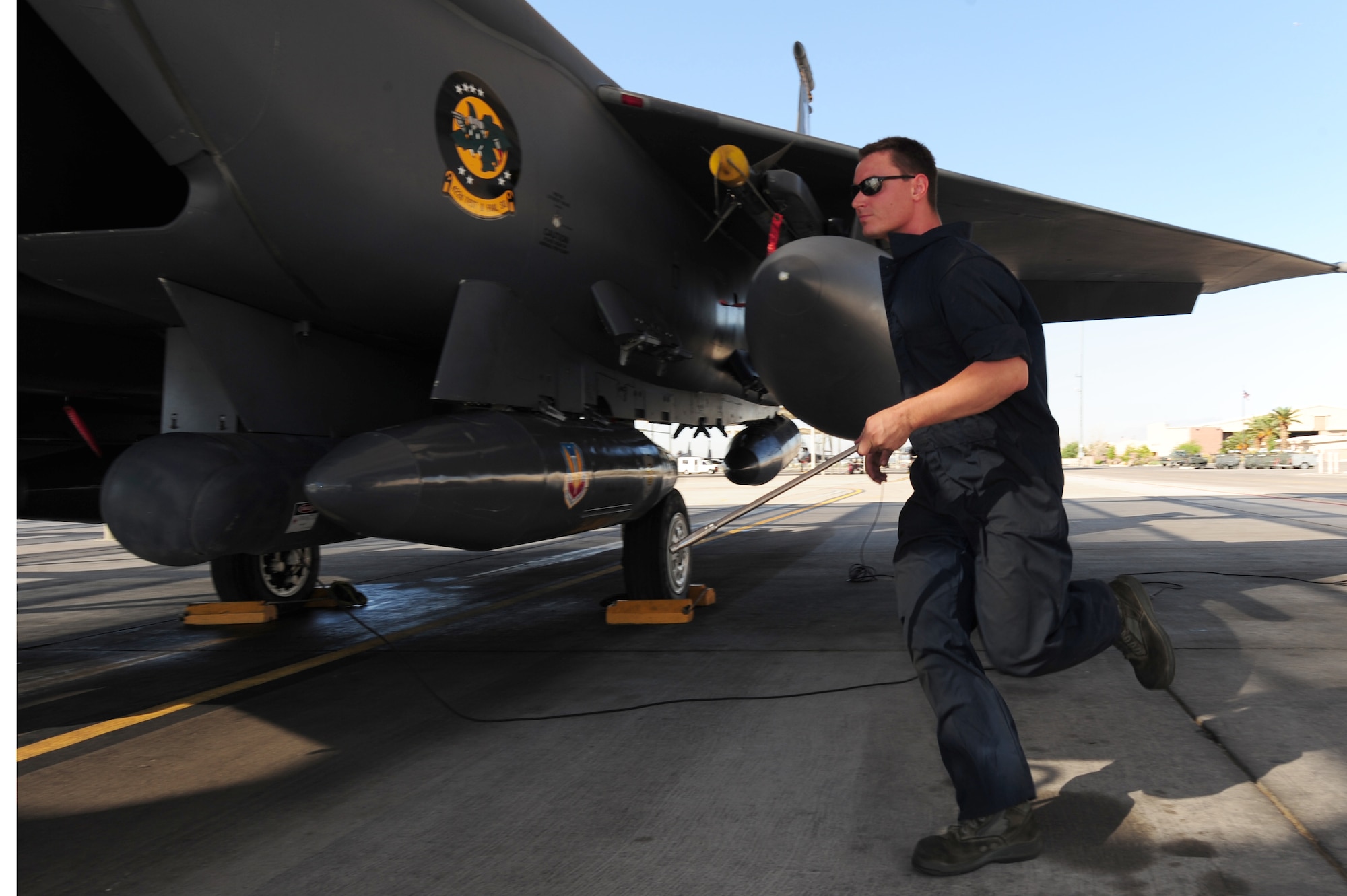 Airman 1st Class Adam Crough, 757th Aircraft Maintenance Squadron crew chief, inspects an F-15 Eagle prior to take off at Nellis Air Force Base, Nev., June 14, 2011.   Airmen from the 757th Aircraft Maintenance Squadron accomplish intermediate-level maintenance on aircraft and support equipment components, maintaining avionics, laser guided weapons systems, pneudraulics, fuel systems, engines, measurement/diagnostic equipment, electro-environmental, and egress systems.  (U.S. Air Force photo by Staff Sgt. William P.Coleman)
  

