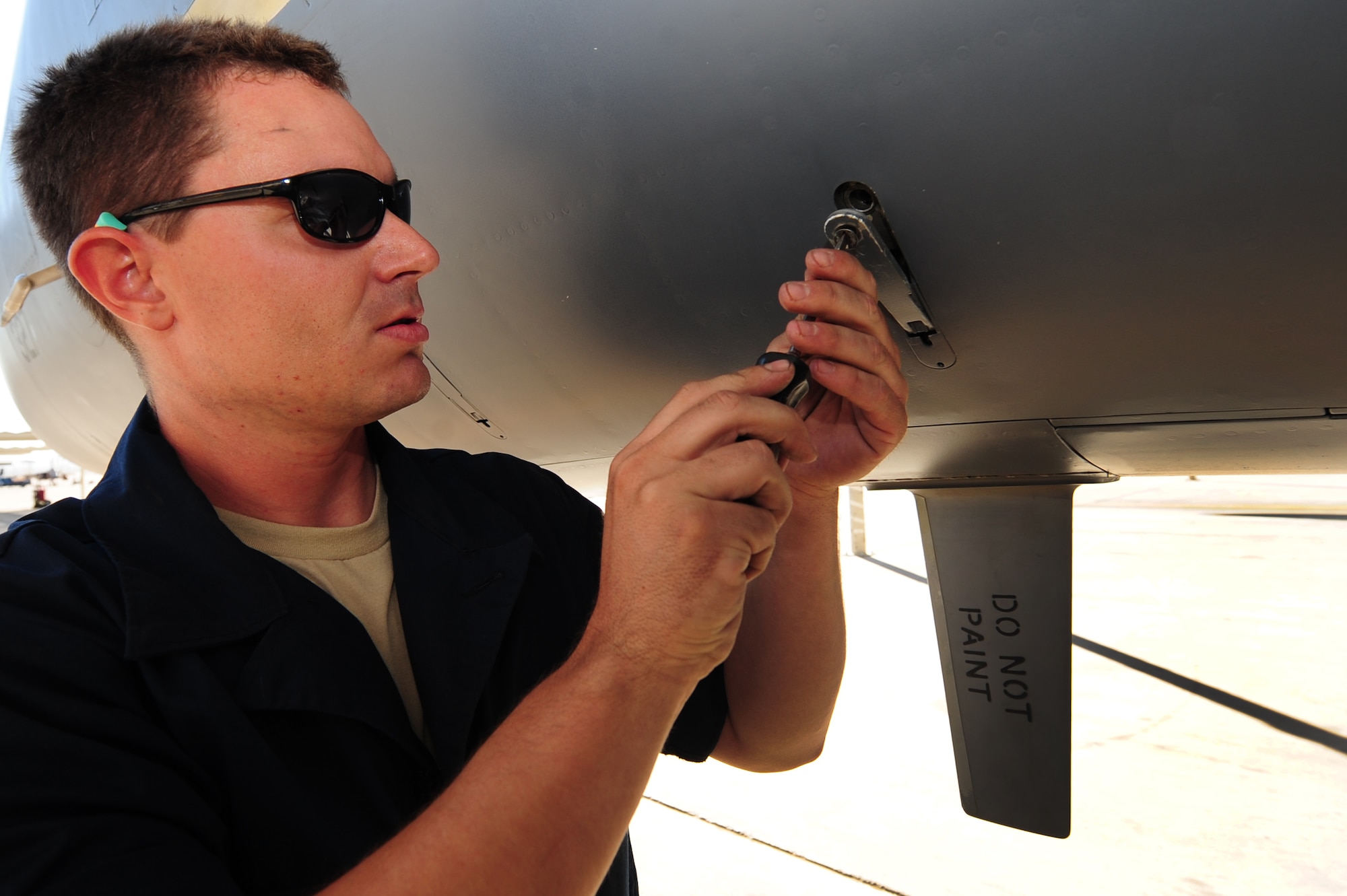 Airman 1st Class Adam Crough, 757th Aircraft Maintenance Squadron crew chief, fastens panels on an F-15 Eagle prior to take off at Nellis Air Force Base, Nev., June 14, 201!.  Airmen from the 757th Aircraft Maintenance Squadron accomplish intermediate-level maintenance on aircraft and support equipment components, maintaining avionics, laser guided weapons systems, pneudraulics, fuel systems, engines, measurement/diagnostic equipment, electro-environmental, and egress systems.  (U.S. Air Force photo by Staff Sgt. William P.Coleman/Released)
  

