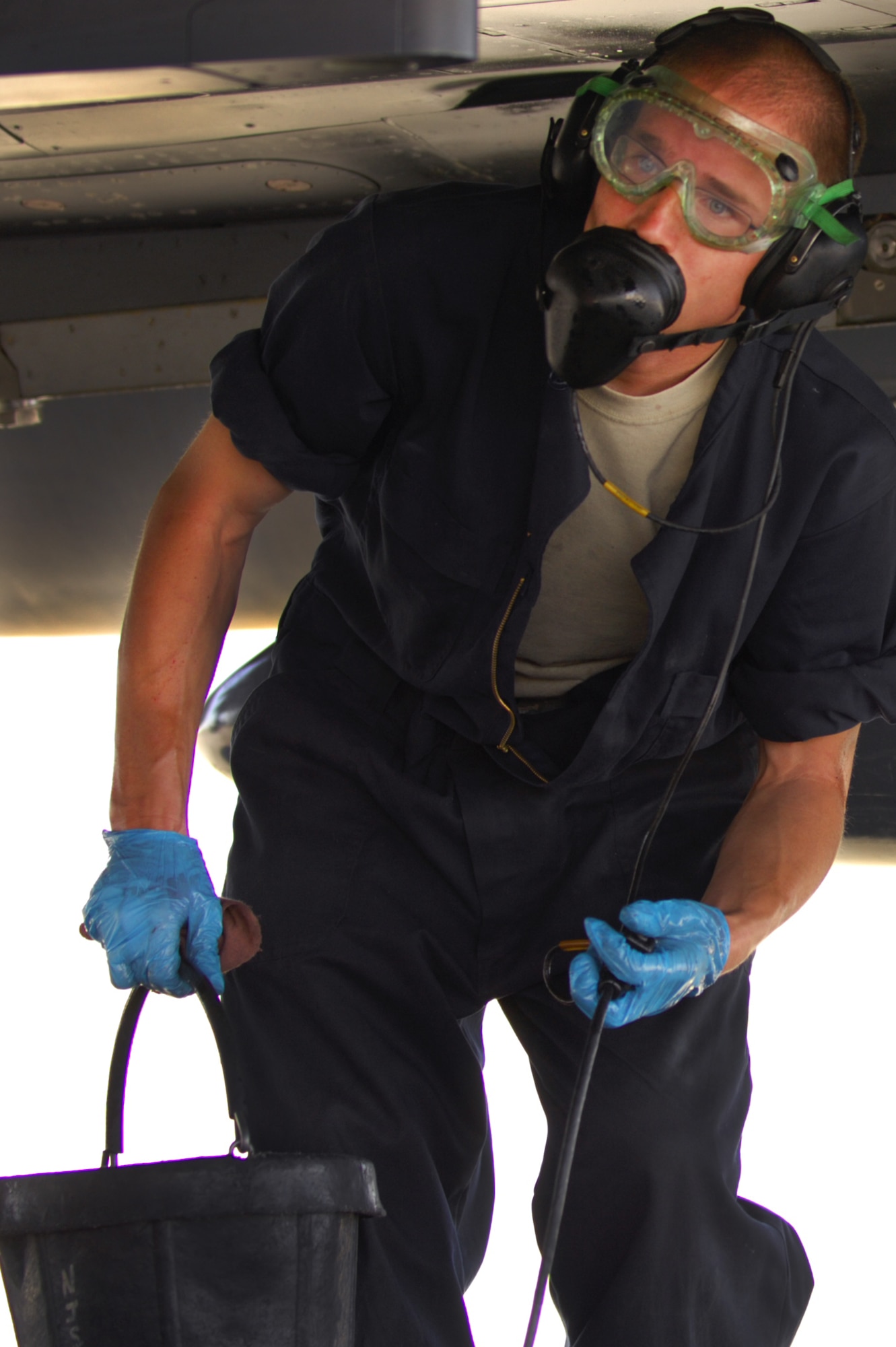 Airman 1st Class Justin Crumbley, 757th Aircraft Maintenance Squadron crew chief, replenishes hydraulic fluid into the reservoir of an F-15 Eagle prior to take off at Nellis Air Force Base, Nev., June 14, 2011.   Airmen from the 757th Aircraft Maintenance Squadron accomplish intermediate-level maintenance on aircraft and support equipment components, maintaining avionics, laser guided weapons systems, pneudraulic system, fuel systems, engines, measurement/diagnostic equipment, electro-environmental, and egress systems.  (U.S. Air Force photo by Staff Sgt. William P.Coleman)
  

