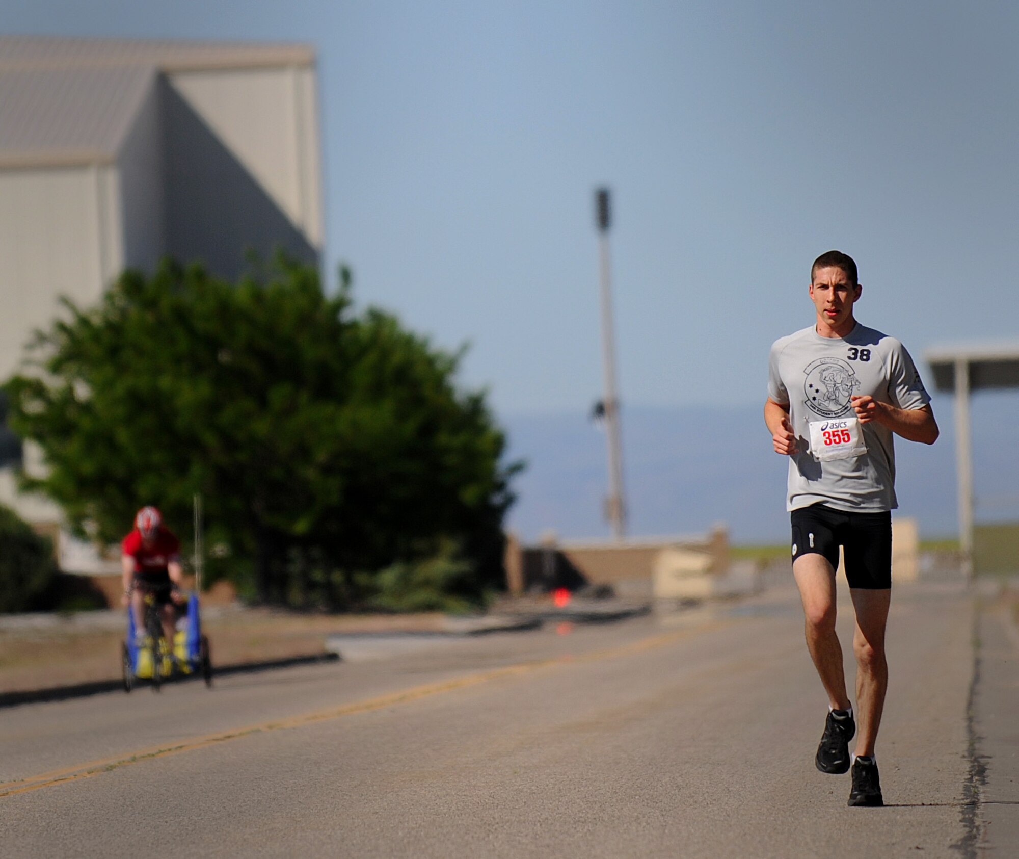 MOUNTAIN HOME AIR FORCE BASE, Idaho – 2nd Lt. Ryan Hoff, 366th Civil Engineer Squadron project manager, finishes the triathlon with the five kilometer run here June 25. Lieutenant Hoff finished the race in first place with a time of 58:54. (U.S. Air Force photo by Staff Sgt. Gina Chiaverotti-Paige)