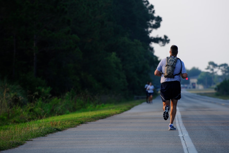 A member of the 823rd RED HORSE Squadron runs with a hydration backpack during a physical training session at Hurlburt Field, Fla., June 13, 2011. Drinking 15 to 20 fluid ounces before your workout and eight to 10 fluid ounces during your workout are the recommended amounts for proper hydration. (U.S. Air Force photo by Staff Sgt. Julianne M. Showalter/RELEASED) 