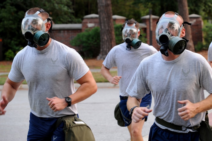 Members of the 437th Aircraft Maintenance Squadron finish their physical training session with a gas mask run June 22 at Joint Base Charleston. Members from the 437th Aerial Port Squadron and the 437 AMXS meet every Wednesday to prepare for the 2011 Air Mobility Command Rodeo scheduled for July 23 - 29 at Joint Base Lewis-McCord, Wash.    (U.S. Air Force photo/Staff Sgt. Nicole Mickle)