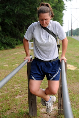 Staff Sgt. Ashley Kelly does dips on the parallel bars June 22 at Joint Base Charleston. Members from the 437th Aerial Port Squadron and the 437th Aircraft Maintenance Squadron meet every Wednesday to prepare for the 2011 Air Mobility Command Rodeo scheduled for July 23 - 29 at Joint Base Lewis-McCord, Wash.  Sergeant Kelly is from the 437 APS.  (U.S. Air Force photo/Staff Sgt. Nicole Mickle)
