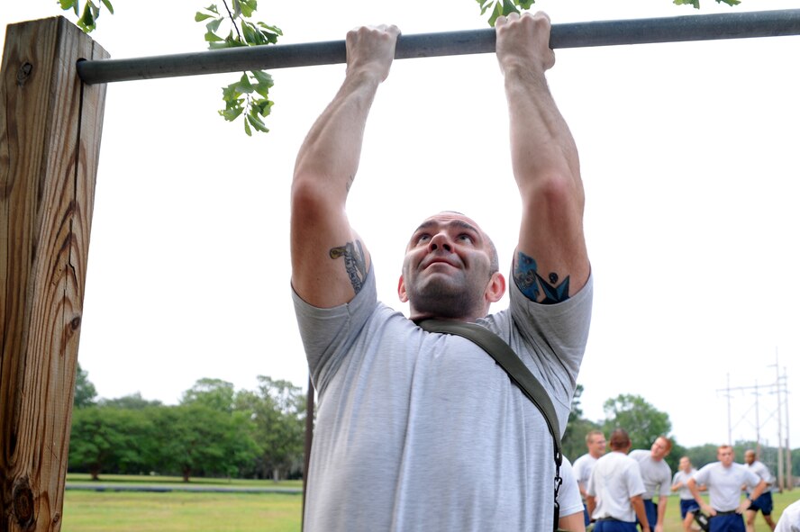 Tech. Sgt. Jason Gates does pull-ups June 22, 2011, at Joint Base Charleston, S.C., as he prepares for the upcoming Air Mobility Command Rodeo. Sergeant Gates and other Rodeo-team members from the 437th Aerial Port Squadron and the 437th Aircraft Maintenance Squadron meet every Wednesday to prepare for the 2011 Air Mobility Rodeo held by Air Mobility Command. Sergeant Gates is from the 437th APS. (U.S. Air Force Photo/Staff Sgt. Nicole Mickle) 

