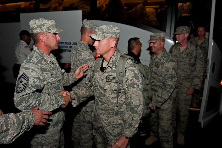 U.S. Air Force Airmen with the 820th Base Defense Group receive warm welcomes from unit members June 26, 2011, at Moody Air Force Base, Ga. Approximately 30 members of the 820th BDG returned home from a six-month deployment to Shindand Air Base, Afghanistan. (U.S. Air Force photo by Staff Sgt. Jamal D. Sutter/Released)