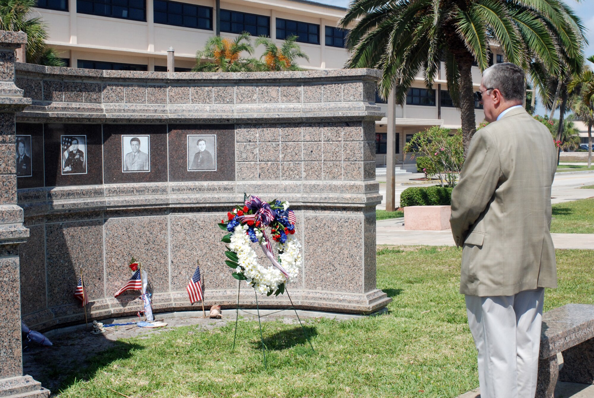 PATRICK AIR FORCE BASE, Fla.- Retired Col. Thomas Friers, takes a moment to remember his fallen comrades at the Khobar Towers memorial here at Memorial Plaza. Mr. Friers was the 1st Rescue Group Commander here at Patrick AFB when the attack happened. The 920th Rescue Wing, originally the 301st Rescue Squadron, was activated in 1956, becoming the Air Force Reserve's first rescue squadron. (U.S. photo/Airman First Class Natasha Dowridge)