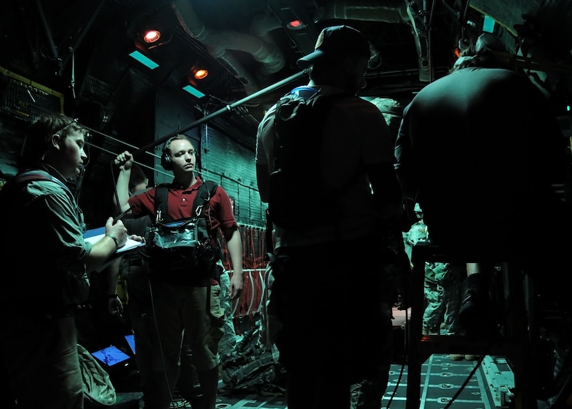 A video crew sets up to record a scene during a simulated jump on the flight line at Duke Field, Fla., June 15. The production company, WILL Interactive, started work on a choose-your-own-adventure film for Department of Defense jumpmaster training at Fort Benning, Ga., with help from members from the U.S. Army Airborne School. However, when the crew needed a C-130 in portions of the video, the 919th Special Operations Wing offered to support the project at Duke Field June 13-15. (U.S. Air Force photo/Tech. Sgt. Cheryl Foster) 