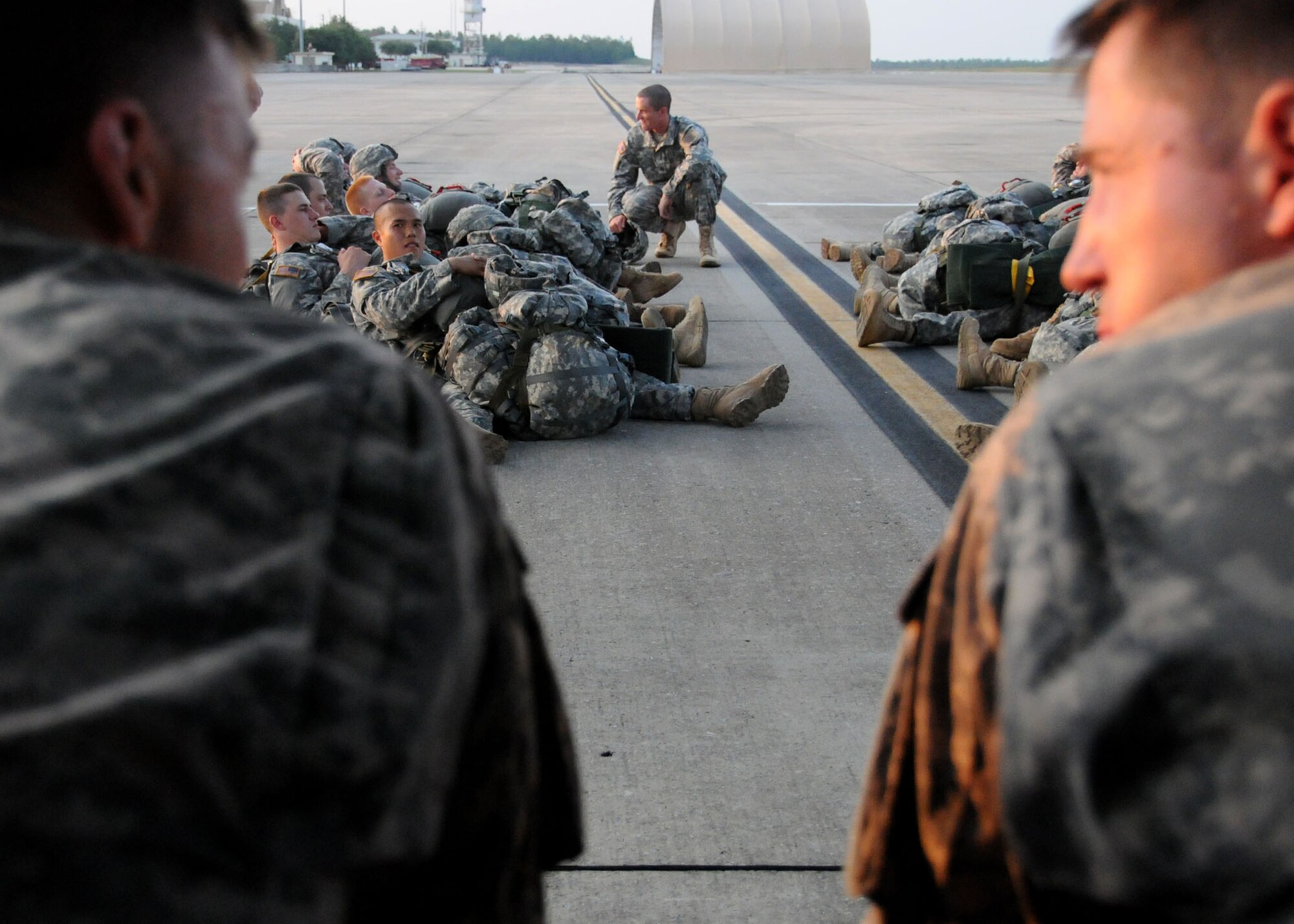 Army privates, students awaiting training at the U.S. Army Airborne School, wait to board the aircraft for a simulated jump on the flight line at Duke Field, Fla., June 15. The production company, WILL Interactive, started work on a choose-your-own-adventure film for Department of Defense jumpmaster training at Fort Benning, Ga., with help from members from the U.S. Army Airborne School. However, when the crew needed a C-130 in portions of the video, the 919th Special Operations Wing offered to support the project at Duke Field June 13-15. (U.S. Air Force photo/Tech. Sgt. Cheryl Foster) 