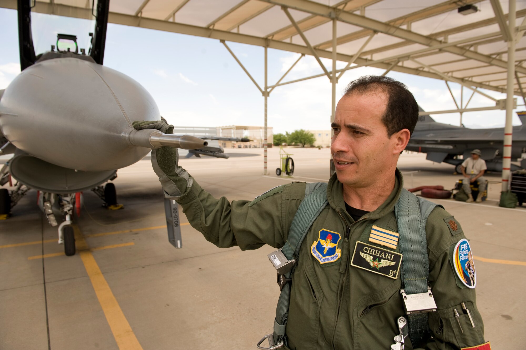 Royal Moroccan Air Force Maj. Mouloud Chihani performs a preflight check on an F-16 Fighting Falcon at Tucson International Airport before a training mission July 7, 2010. Chihani and three other Moroccan pilots are the first F-16 pilots in their air force and will lead the way to establish a new squadron of block 52s when they return home this July. (U.S. Air Force photo/Master Sgt. Jack Braden)