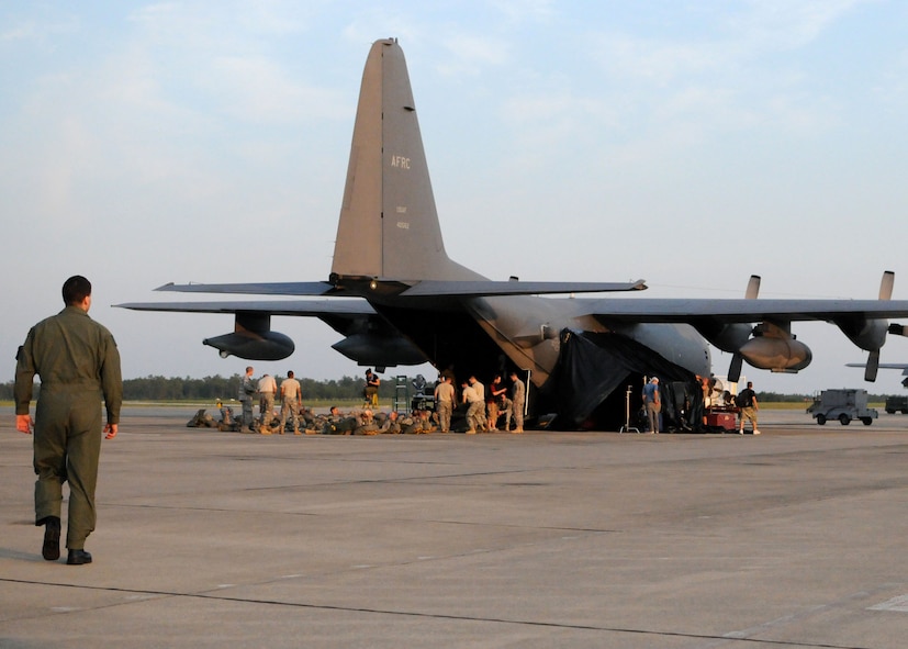 An actor walks toward an aircraft on the flight line at Duke Field, Fla., June 15. The production company, WILL Interactive, started work on a choose-your-own-adventure film for Department of Defense jumpmaster training at Fort Benning, Ga., with help from members from the U.S. Army Airborne School. However, when the crew needed a C-130 in portions of the video, the 919th Special Operations Wing offered to support the project at Duke Field June 13-15. (U.S. Air Force photo/Tech. Sgt. Cheryl Foster) 