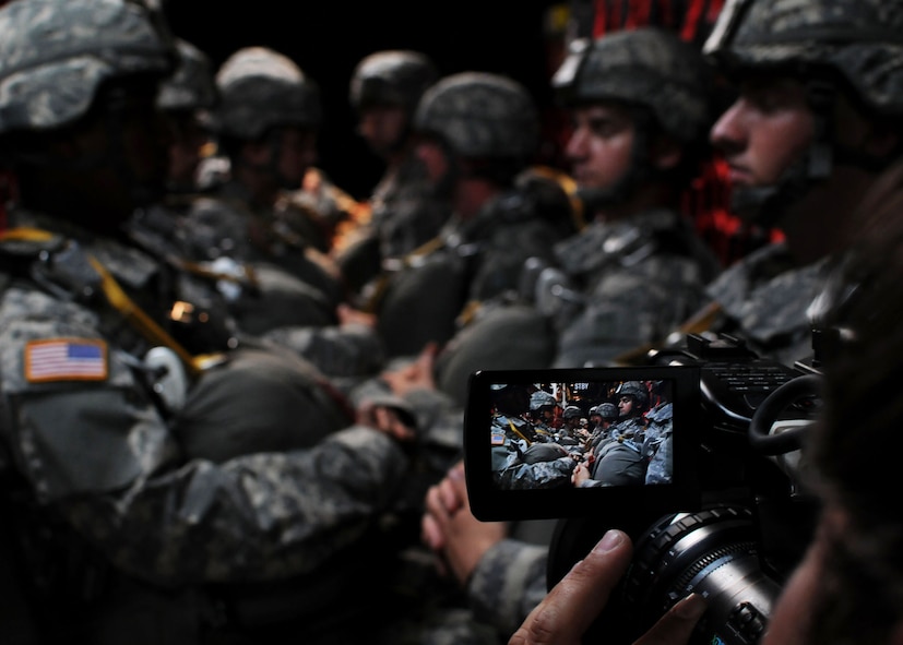 A videographer records a simulated jump scene on the flight line at Duke Field, Fla., June 14. The production company, WILL Interactive, started work on a choose-your-own-adventure film for Department of Defense jumpmaster training at Fort Benning, Ga., with help from members from the U.S. Army Airborne School. However, when the crew needed a C-130 in portions of the video, the 919th Special Operations Wing offered to support the project at Duke Field June 13-15. (U.S. Air Force photo/Tech. Sgt. Cheryl Foster) 
