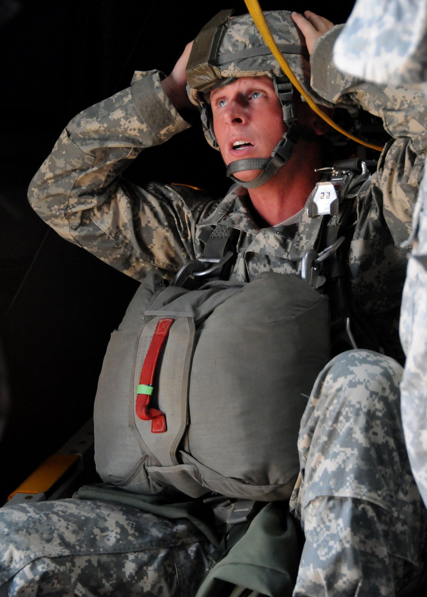 Will Illg, an actor, reacts to a scene during a simulated jump on the flight line at Duke Field, Fla., June 14. The production company, WILL Interactive, started work on a choose-your-own-adventure film for Department of Defense jumpmaster training at Fort Benning, Ga., with help from members from the U.S. Army Airborne School. However, when the crew needed a C-130 in portions of the video, the 919th Special Operations Wing offered to support the project at Duke Field June 13-15. (U.S. Air Force photo/Tech. Sgt. Cheryl Foster)