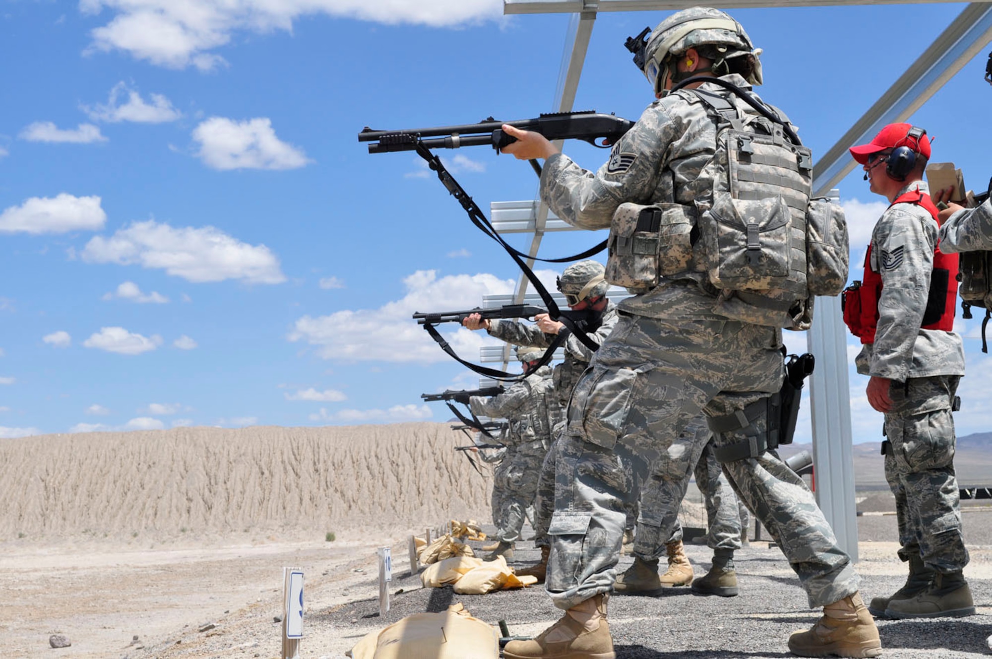 Members of the 152AW Security Forces qualifying with the M-870 12-gauge shotgun.