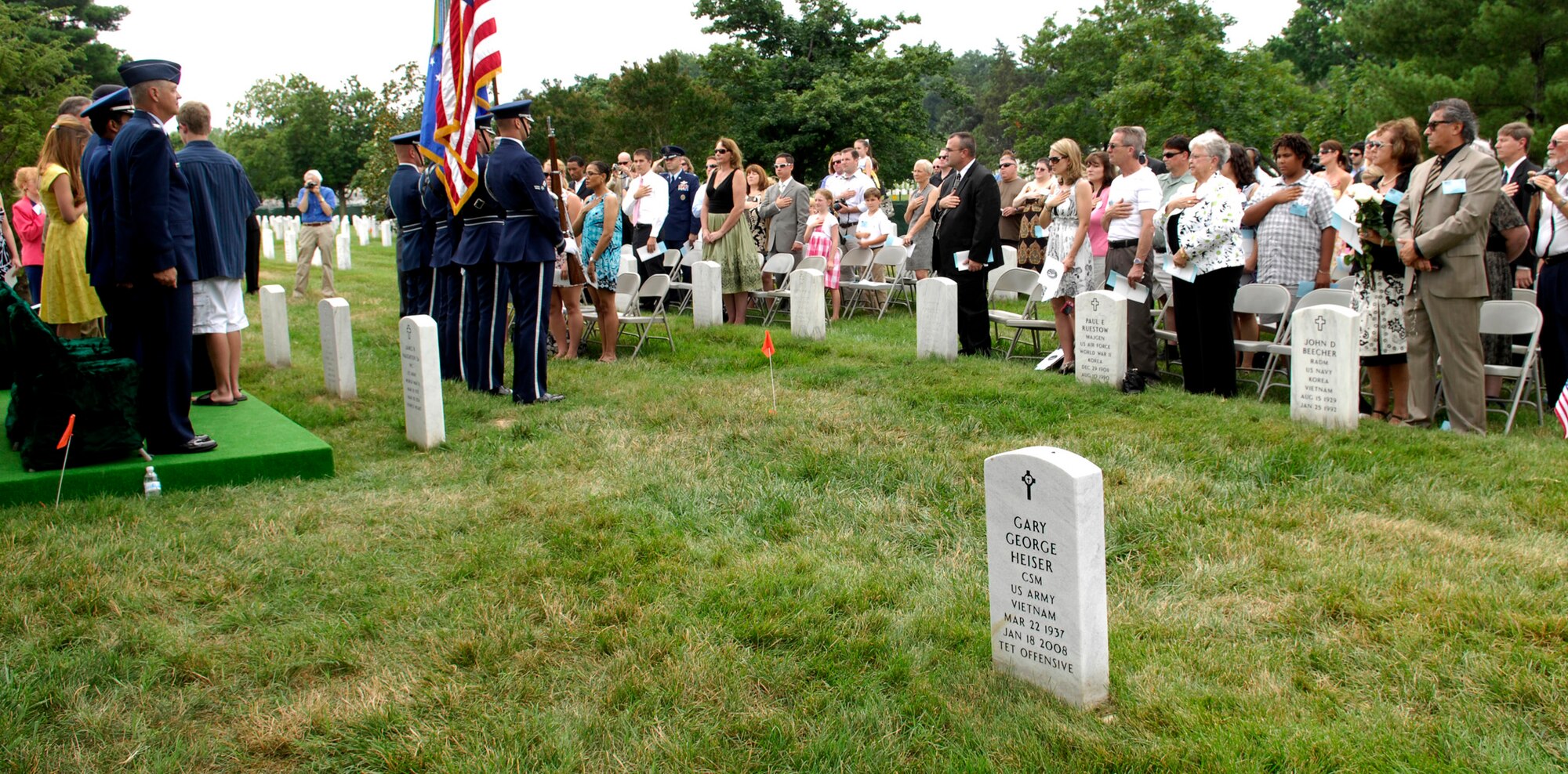Guests recite the Pledge of Allegiance during a remembrance ceremony, June 25, 2011, at Arlington National Cemetery, Va., to mark the 15th anniversary since the Khobar Towers bombing. Nineteen Airmen were killed in the terrorist bombing, June 25, 1996, at Dhahran Air Base, Saudi Arabia. (U.S. Air Force photo/Staff Sgt. Tiffany Trojca)