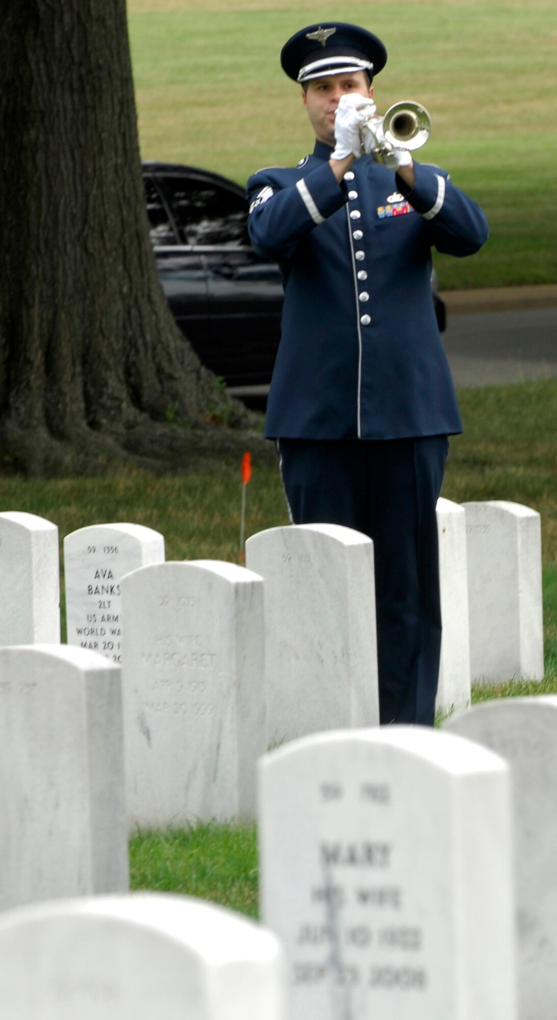 Tech. Sgt. Patrick McDermott, of the  U.S. Air Force Band, plays "Taps" during a remembrance ceremony June 25, 2011, at Arlington National Cemetery, Va., to mark the 15th anniversary since the Khobar Towers bombing. Nineteen Airmen were killed in the terrorist bombing, June 25, 1996, at Dhahran Air Base, Saudi Arabia. (U.S. Air Force photo/Staff Sgt. Tiffany Trojca)