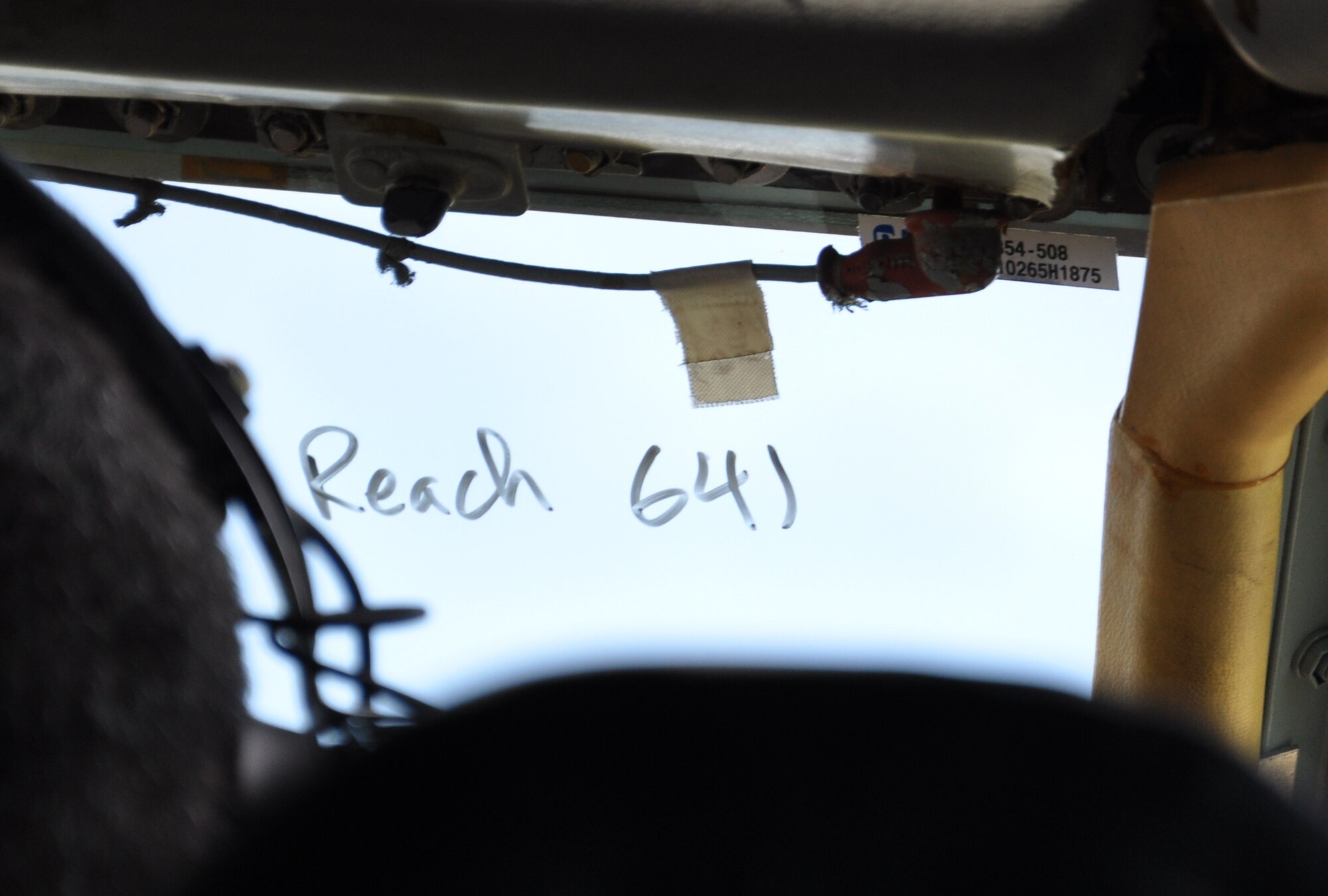 The mission call sign “Reach 641” is wax-penciled on the windshield of a KC-135 Stratotanker on June 21, 2011, at Moses Lake, Wash. The KC-135 was being deployed from its home at Fairchild Air Force Base, Wash., to the Transit Center at Manas, Kyrgyzstan, where the tanker crew for the plane flew it over the Arctic Circle  and the North Pole for the first time June 21 to 22, 2011, as part of an “iron swap” mission along a new, more efficient route from Washington state to Kyrgyzstan. (U.S. Air Force Photo/Capt. Kathleen Ferrero) 