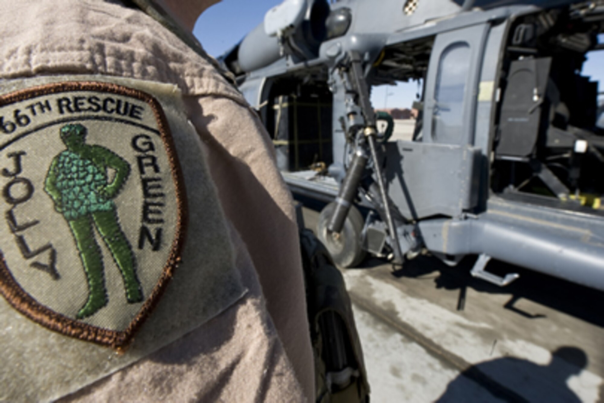 U.S. Air Force Staff Sgt. David Mullikin displays his unit patch, Nellis Air Force Base, Nev., June 23, 2011. Sergeant Mullikin is a flight engineer assigned to the 66th Rescue Squadron whose patch symbolizes a tradition passed down from the Vietnam War.  (U.S Air Force photo by Senior Airman Stephanie Rubi / Released)