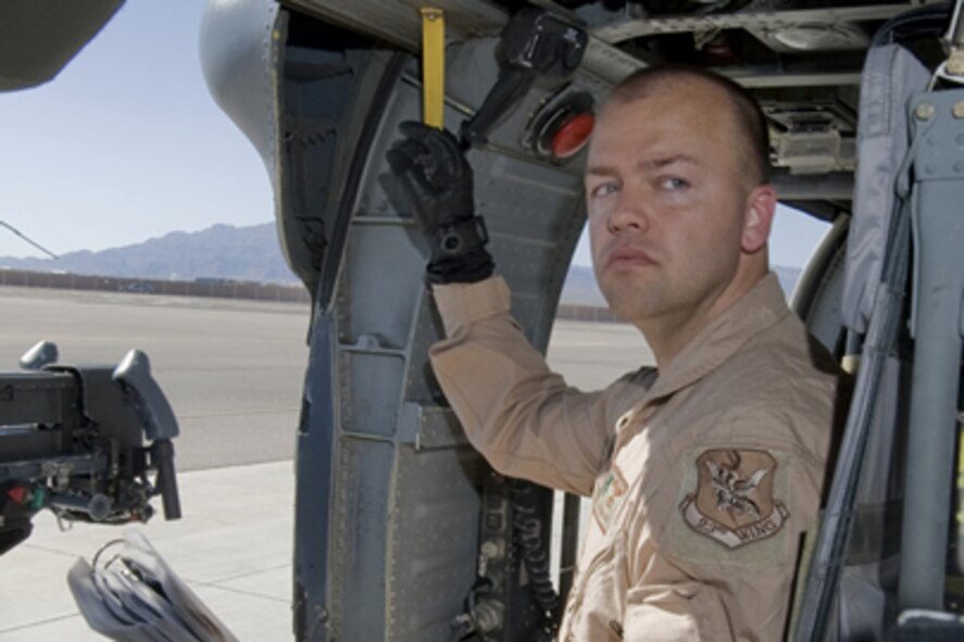 Staff Sgt. David Mullikin performs a pre-operations check for an HH-60
Pavehawk at Nellis Air Force Base, Nev., June 23, 2011. Sergeant Mullikin is
a flight engineer assigned to the 66th Rescue Squadron. He returned from a
tour in Iraq suffering from post-traumatic stress disorder and got help
through the Air Force Wounded Warrior program.  (U.S Air Force photo/Senior
Airman Stephanie Rubi)
