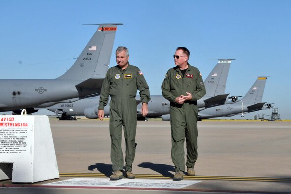 Brig. Gen. Roy E. Uptegraff, Commander 313th Air Expeditionary Wing (left) and Col. Ted Metzgar, Commander 128th Air Refueling Wing discuss dynamics of operations at the 313 AEW prior to Col. Metzgar assuming command of the wing on June 14, 2011 in Western Europe (U.S. Air Force Photo/Capt. John P. Capra)