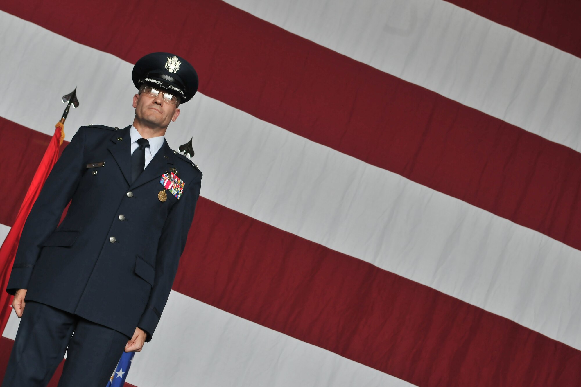 Col. Eric Gates (left), former 39th Maintenance Group commander, stands at attention during the 39th MXG inactivation ceremony June 14, 2011, in Hangar 4 at Incirlik Air Base, Turkey.  (U.S. Air Force photo by Staff Sgt. Alexandre Montes/Released)