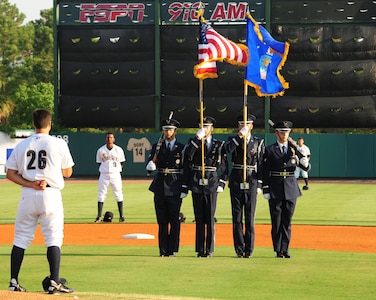 Members of the Joint Base Charleston Honor Guard present the colors for the opening of  Military Appreciation Night  June 25 at Joseph P. Riley Jr. Park in Charleston, S.C. The Honor Guard members (from to right) are Airman 1st Class Alex Ortiz, 628th Medical Group, Senior Airman David Glessing, 437th Aircraft Maintenance Squadron, Airman 1st Class Dylan Thomas, 628th Mission Support Group and Airman 1st Class Allen Miller, 437th Maintenance Squadron. (U.S. Air Force photo/Tech. Sgt. Chrissy Best)