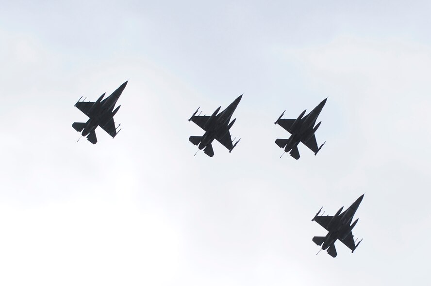 MISAWA AIR BASE, Japan -- Four F-16 Fighting Falcons fly over Misawa City at the conclusion of the opening ceremony for the 23th Annual American Day festival June 26, 2011. The event allows the base to share American traditions with their Japanese neighbors. (U.S. Air Force photo/Staff Sgt. Marie Brown/Released)