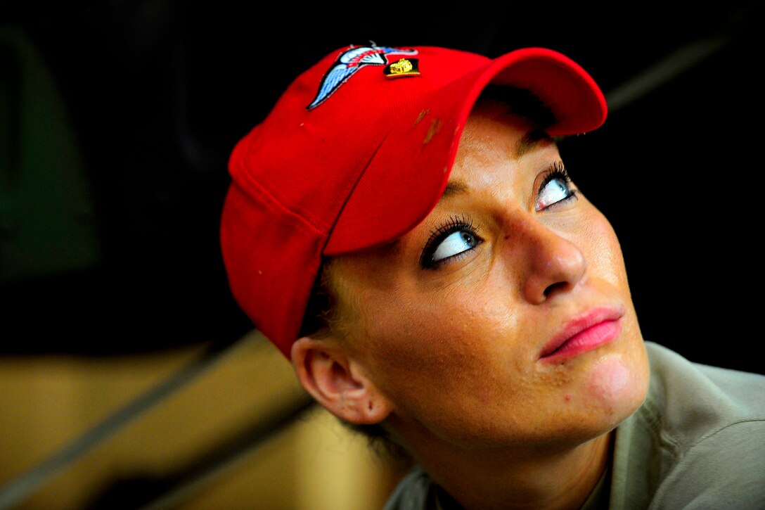 Army Spc. Mia Scully takes a break from work during a joint operations access exercise on Fort Bragg, N.C., June 20, 2011. Scully is a parachute rigger assigned to the 11th Quartermaster Company, Special Troops Battalion, 82nd Sustainment Brigade.