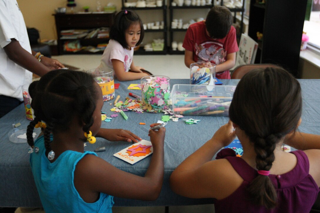 Children of service members worked on crafts during the Crafty Campers event hosted by Armed Services YMCA at Tarawa Terrace aboard the Marine Corps Base Camp Lejeune housing area, June 28. The program is open to children of authorized Department of Defense identification cardholders ages 6 through 10.