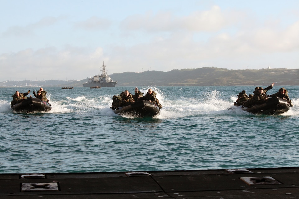 Marines with Company F, Battalion Landing Team 2nd Battalion, 7th Marine Regiment, 31st Marine Expeditionary Unit, prepare to board the USS Tortuga during launch and recovery operations June 28. Once onboard the Tortuga, the Marines turned the boats around and returned to the water.