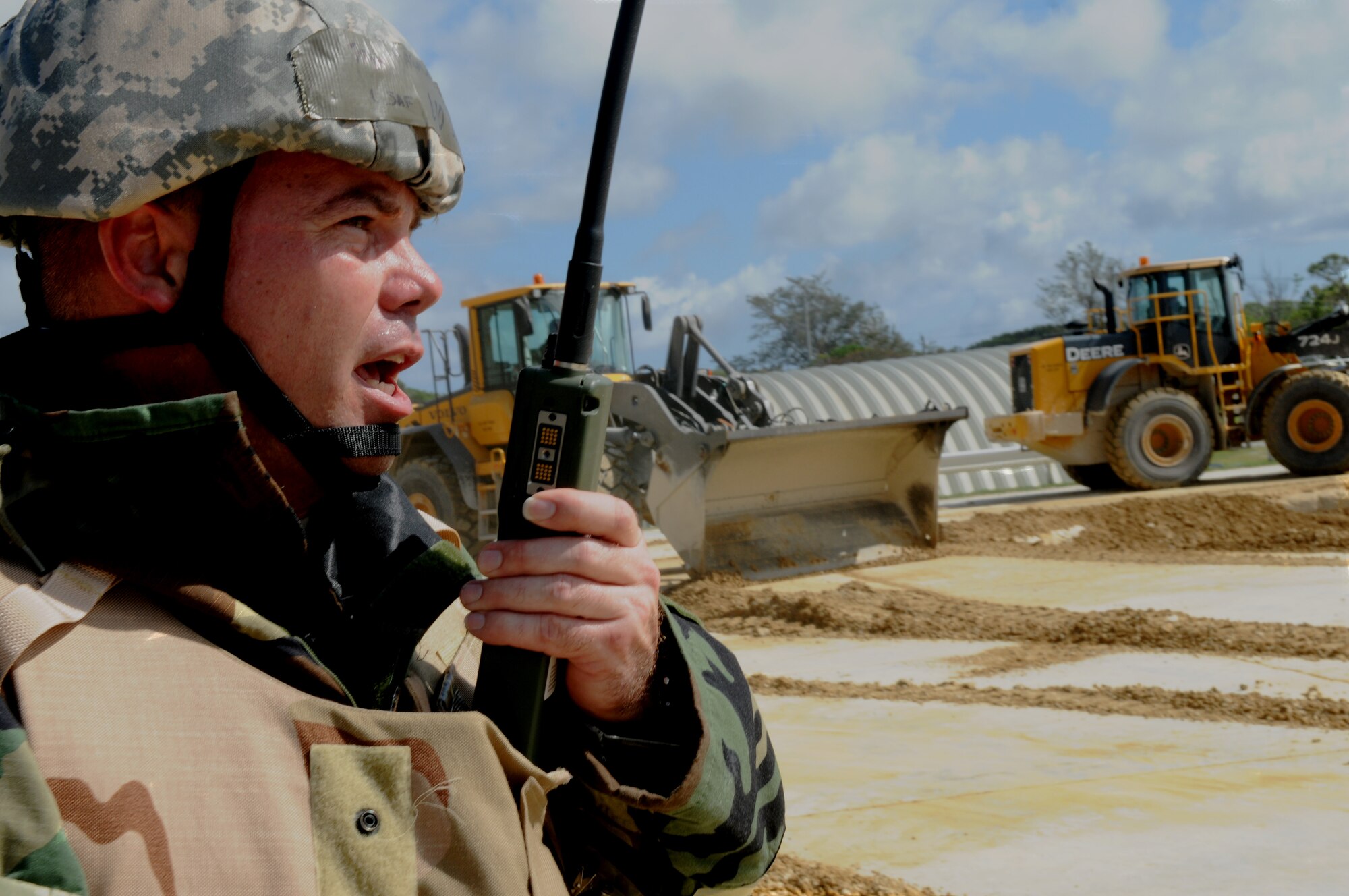 Tech. Sgt. Mark Farmer, 647th Civil Engineer Squadron pavement and heavy equipment operator with Joint Base Pearl Harbor–Hickam, Hawaii, relays information about crater damage to the airfield damage repair chief during Silver Flag 11-06 at Kadena Air Base, Japan, June 28. Approximately 120 Airmen, Sailors and Marines attended the Det. 1 554th Rapid Engineer Deployable Heavy Operational Repair Squadron Engineer Silver Flag exercise here. (U.S. Air Force photo/Airman 1st Class Jarvie Z. Wallace)