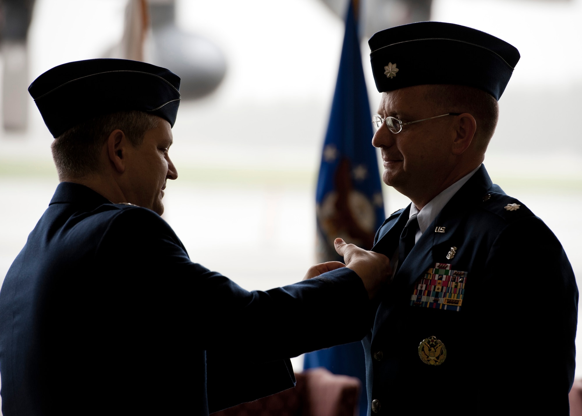 YOKOTA AIR BASE, Japan -- Col. (Dr.) Lee Harvis, 374th Medical Group commander, pins the Air Force commander pin on Lt. Col. James Poel, 374th Aerospace Medicine Squadron, signifying Colonel Poel's new status as a squadron commander at Yokota Air Base, Japan, June 16, 2011. Colonel Poel came to Yokota after working as the public health officer for the 455th Expeditionary Medical Group, Bagram Airfield, Afghanistan. (U.S. Air Force photo/Staff Sgt. Samuel Morse)