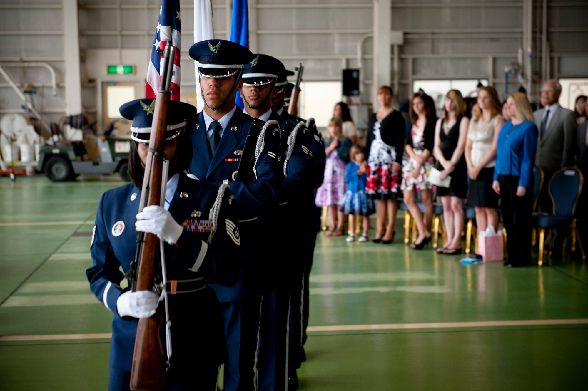 YOKOTA AIR BASE, Japan -- Honor guardsmen from the Yokota Air Base Honor Guard carry the U.S., Japanese and Air Force flags during the 374th Aerospace Medicine Squadron change of command ceremony at Yokota Air Base, Japan, June 16, 2011. (U.S. Air Force photo/Staff Sgt. Samuel Morse)