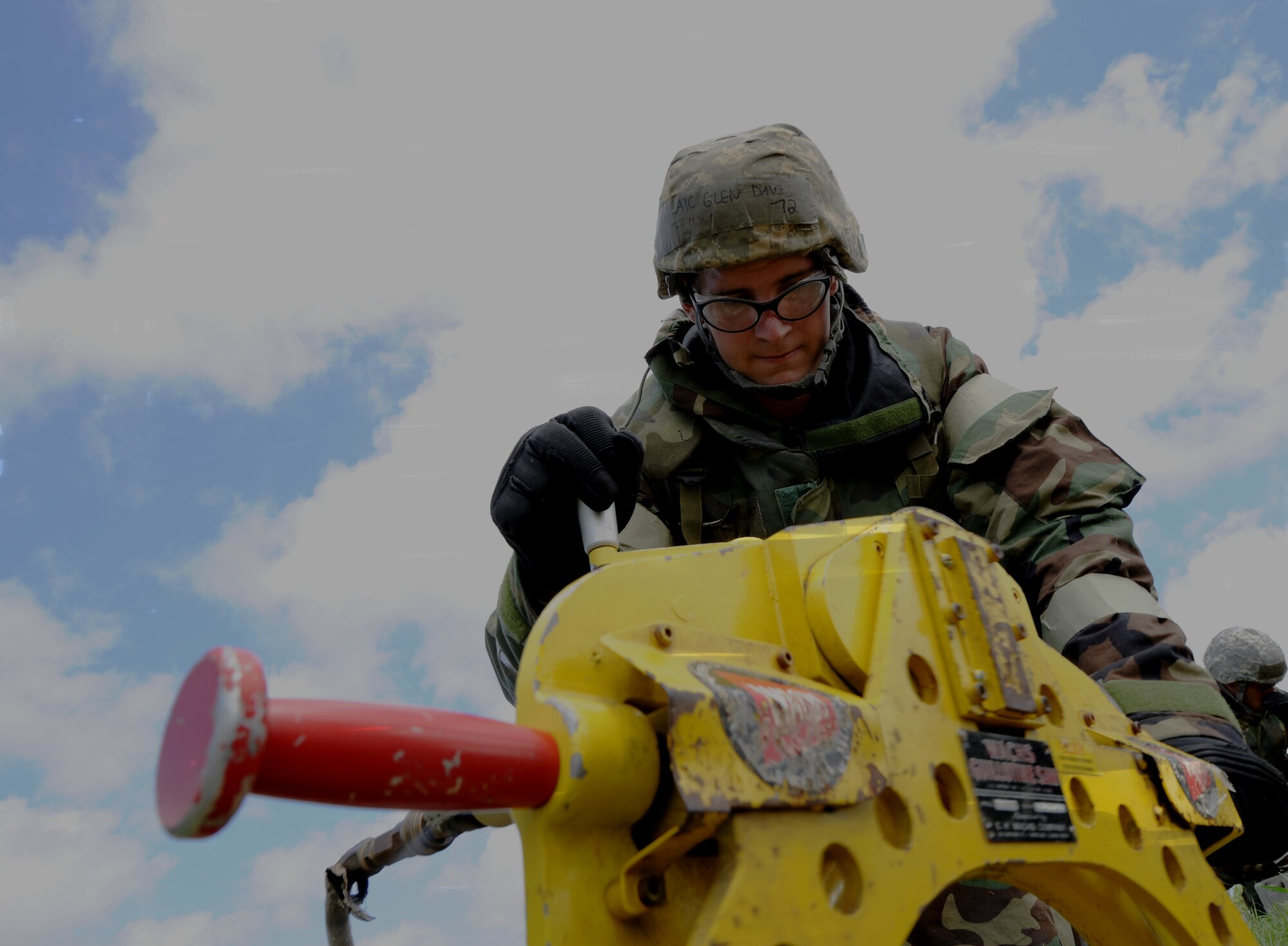 Airman 1st Class Glen Davis,18th Civil Engineer Squadron water and fuel maintenance apprentice, uses a steel cast iron and galvanized piping saw to cut a broken pipeline during Silver Flag 11-06 at Kadena Air Base, Japan, June 28.  Approximately 120 Airmen, Sailors and Marines attended the Det. 1 554th Rapid Engineer Deployable Heavy Operational Repair Squadron Engineer Silver Flag exercise here. (U.S. Air Force photo/Airman 1st Class Jarvie Z. Wallace)