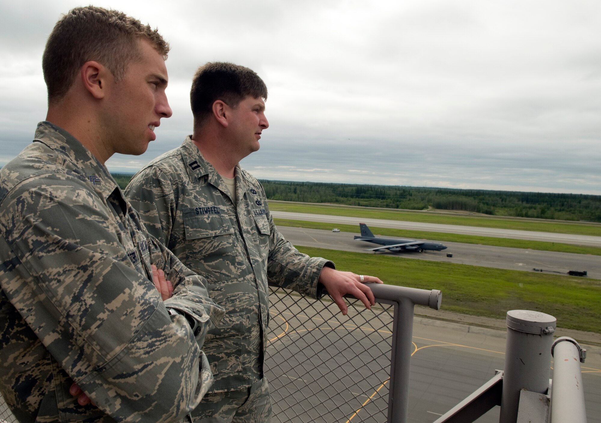 Capt. Daniel Stimpfel and Air Force Academy Cadet 2nd Class Matt Masters look out over the airfield June 22, 2011, Eielson Air Force Base, Alaska. For some cadets, it was the first time seeing the operational side of the Air Force. Captain Stimpfel is the 354th Airfield Operations flight commander. (U.S. Air Force photo/Senior Airman Rachelle Coleman) 