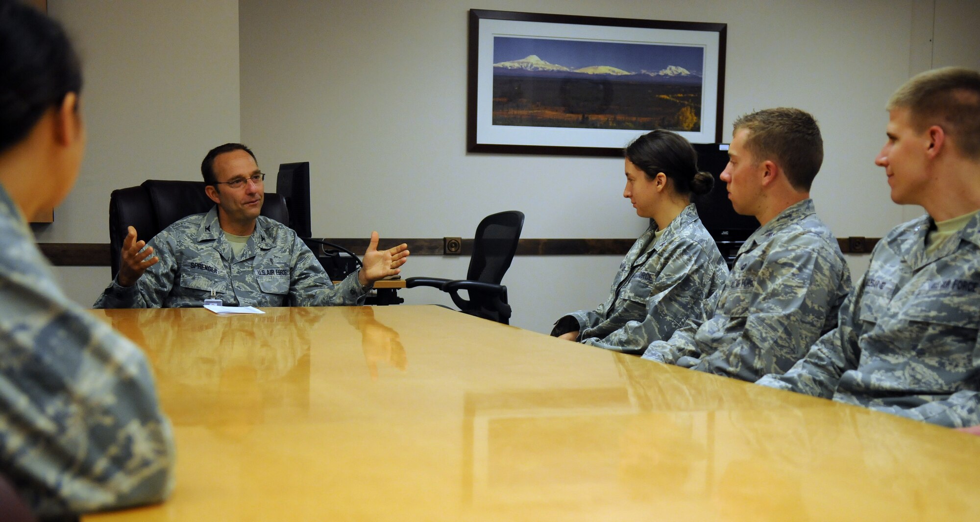 Col. Scott Sprenger talks with cadets from the Air Force Academy during a mentoring session June 22, 2011, Eielson Air Force Base, Alaska. Cadets attended mentoring sessions with commanders and shadowed various jobs around base as a part of Operation Air Force. Colonel Sprenger is the 354th Medical Group commander. (U.S. Air Force photo/Senior Airman Rachelle Coleman)