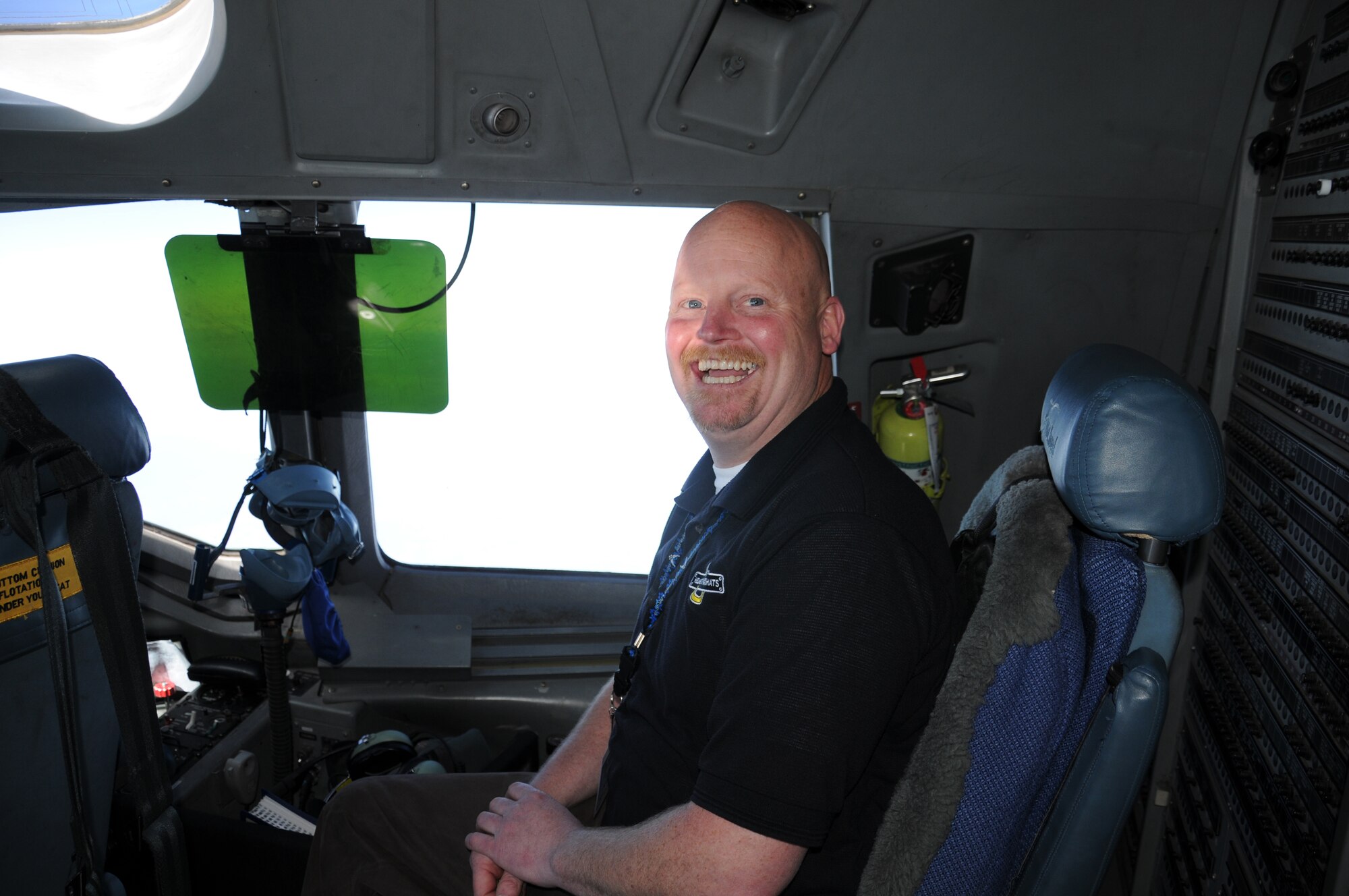 Todd Mitchell with the Washington State Department of Veterans Affairs in Olympia, Wash., enjoys his time on the flight deck of a C-17 Globemaster III June 23.  The 446th Airlift Wing hosted a two day civic leader tour June 23-24.  (U.S. Air Force photo by 2nd Lt. Denise Hauser)
