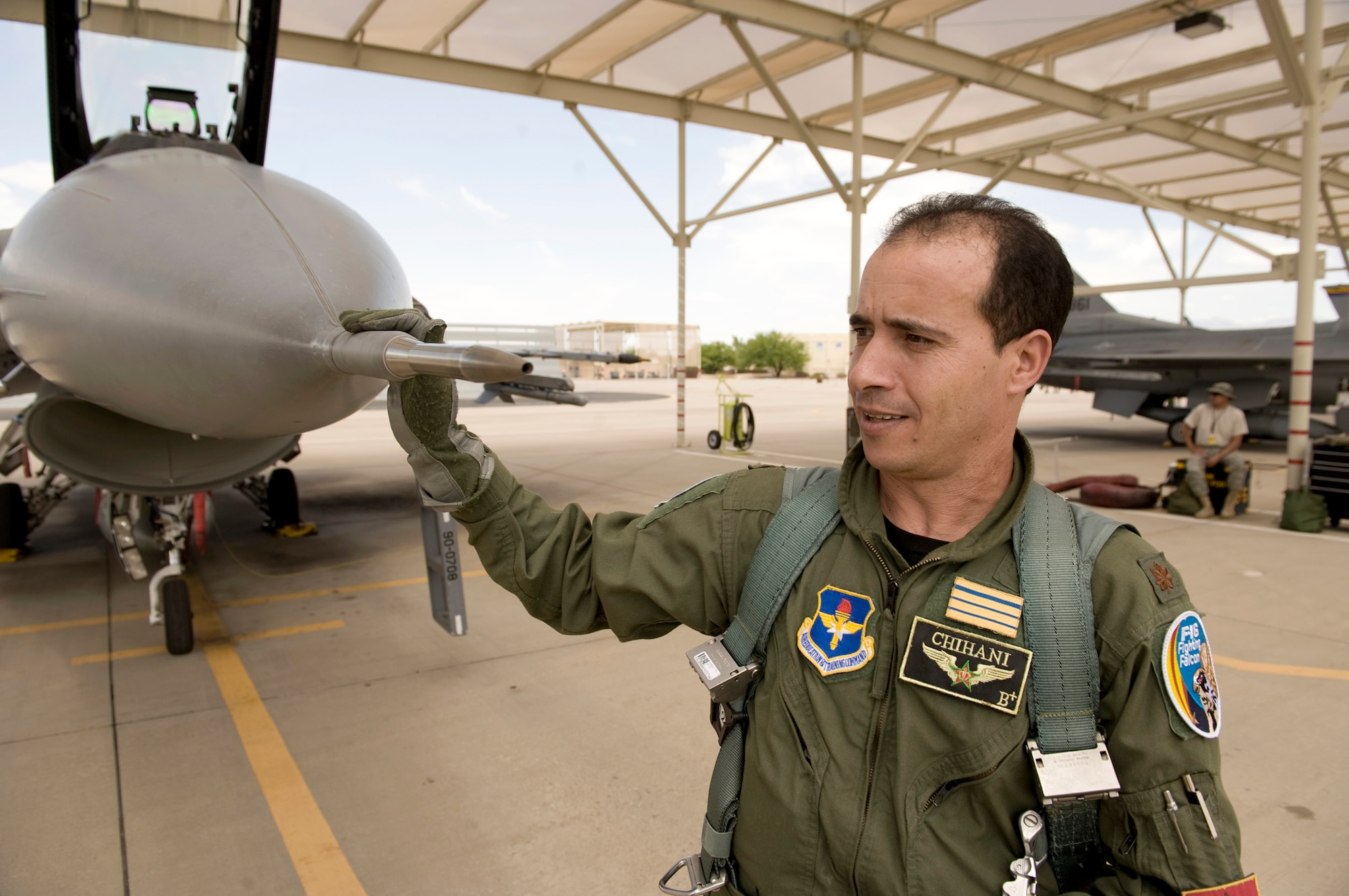 Royal Moroccan Air Force Maj. Mouloud Chihani performs a preflight check on an F-16 Fighting Falcon at Tucson International Airport, Ariz., before a training mission July 7, 2010. Major Chihani and three other Moroccan pilots are the first F-16 pilots in their air force and will lead the way to establish a new squadron of F-16s when they return home in July 2011. (U.S. Air Force photo/Master Sgt. Jack Braden)