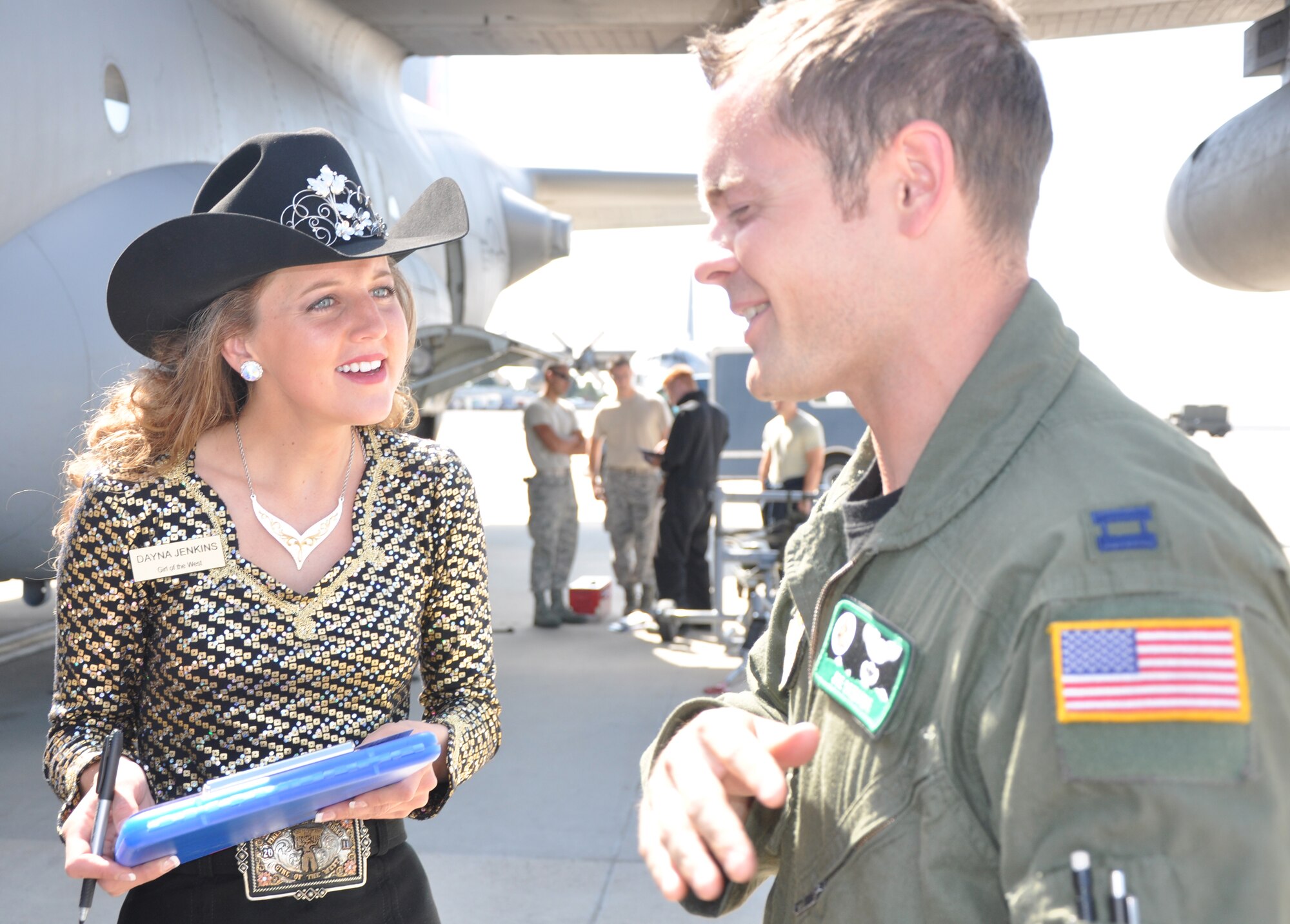 Girl of the West Dayna Jenkins received an up-close look at a 302nd Airlift Wing C-130 Hercules from pilot Capt. Joe Demonte during her visit to the wing June 27 here. To learn more about  the Girls of the West, visit www.coloradospringsrodeo.com. (U.S. Air Force photo/Tech. Sgt. Daniel Butterfield)