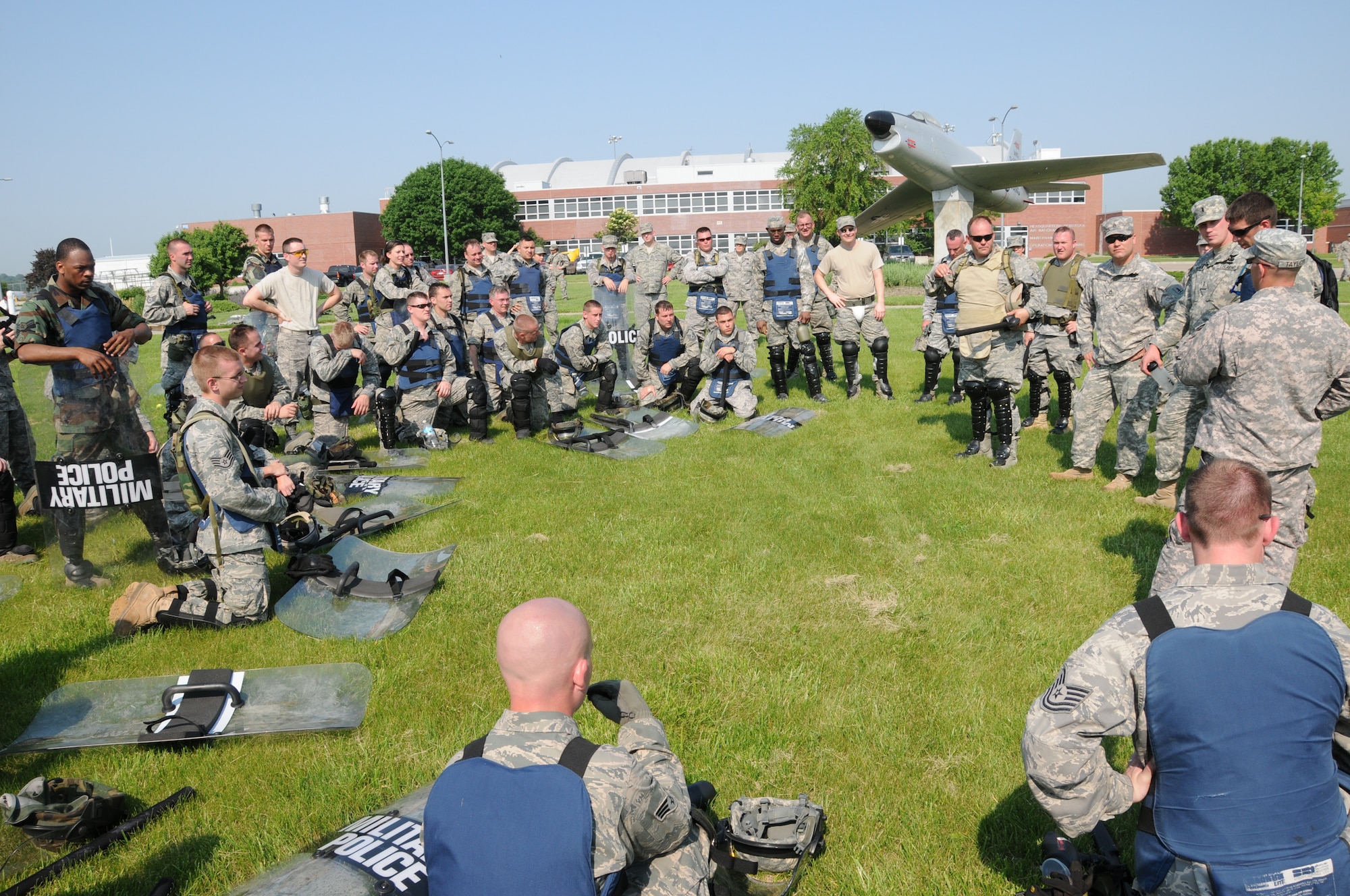 Members of the Nebraska Air National Guard Response Force team are debriefed after an exercise scenario during a National Guard Response Force training exercise held at the Nebraska Air National Guard parade grounds on June 5, 2011 in Lincoln, Neb. (Nebraska Air National Guard photo by Senior Airman James Lieth)