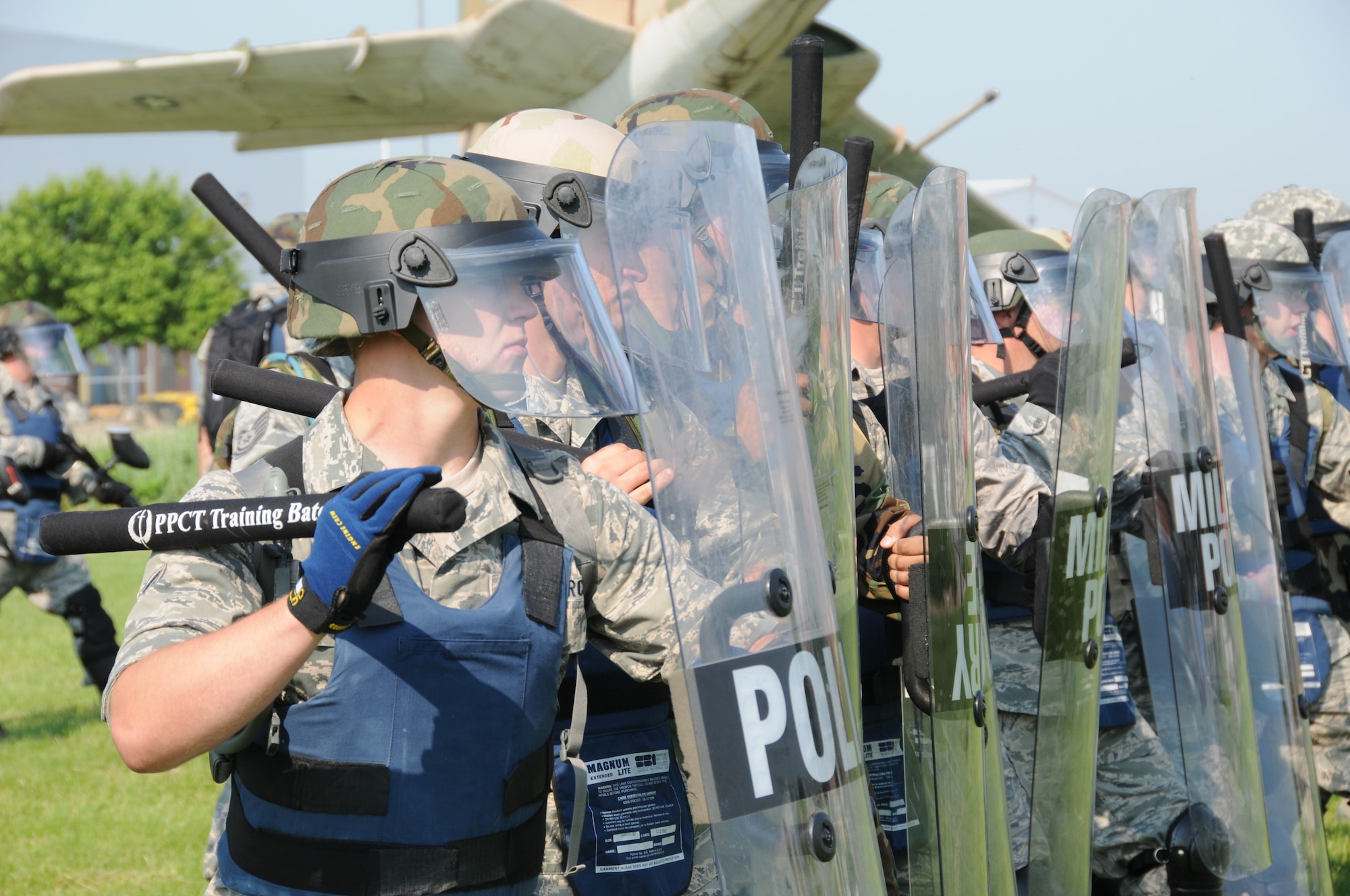 Members of the Nebraska Air National Guard Response Force team advance towards simulated protestors during a National Guard Response Force training exercise held at the Nebraska Air National Guard parade grounds on June 5, 2011 in Lincoln, Neb. (Nebraska Air National Guard photo by Senior Airman James Lieth)
