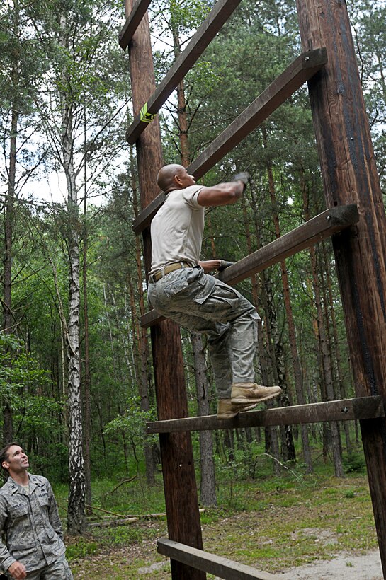 Tech. Sgt. Peter Davey participates in an obstacle course competition June 23, 2011, as part of Allied Strike at Grafenwoehr Training Area, Germany. Sergeant Davey is assigned to the 8th Air Support Operations Squadron. (U.S. Air Force photo/Airman 1st Class Desiree W. Esposito)