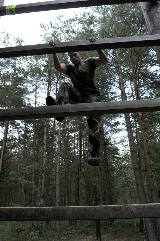 Portuguese army Lt. Antonio Farinha participates in an obstacle course competition June 23, 2011, as part of Allied Strike at Grafenwoehr Training Area, Germany. (U.S. Air Force photo/Airman 1st Class Desiree W. Esposito)