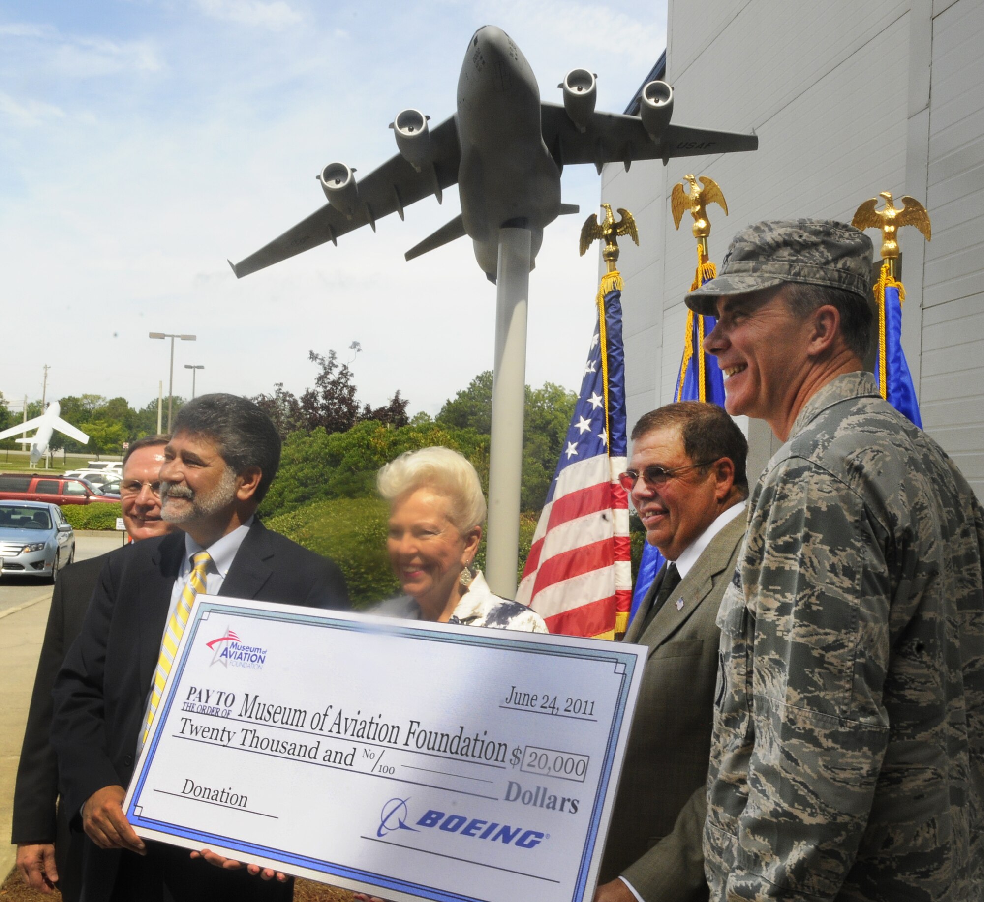 The Boeing Company donated a large model of the C-17 Globemaster III and $20,000 to the Museum of Aviation during a ceremony at the museum June 24. U. S. Air Force photo by Sue Sapp