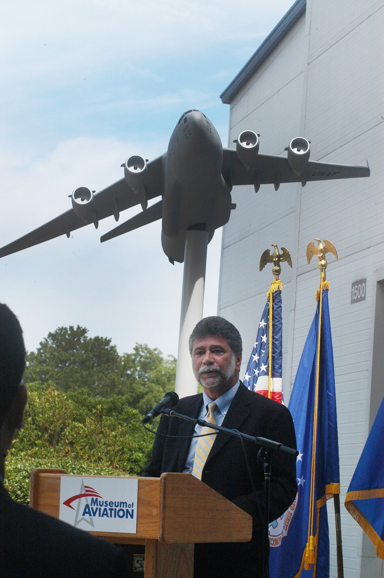Gus Urzua, Boeing vice president and program manager of C-17 Globemaster III Sustainment Partnership, speaks at the Boeing C-17 model dedication at the Museum of Aviation June 24. The Boeing Company donated a large model of the C-17 Globemaster III airlifter to the Museum of Aviation for an outdoor display near the Museum’s Eagle Building South Entrance. The 402d Maintenance Wing at Robins Air Force Base provides depot maintenance, engineering support and software development for the C-17 aircraft. U. S. Air Force photo by Sue Sapp