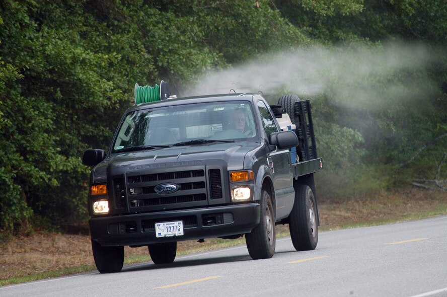 John Rourke, pest control technician,  sprays for adult mosquitoes. U. S. Air Force photo by Sue Sapp