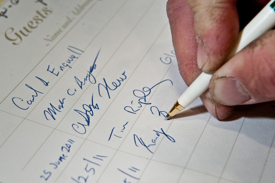 Randy Bader, a museum visitor from Minnesota, signs the Korean Veterans Association Chapter 160 Guest Book June 25, 2011 at the South Dakota Air and Space Museum. Mr. Bader brought his family to learn some history and meet with Korean War veterans, who were there to educate the public and commemorate the 61st anniversary of the start of the Korean War. (U.S. Air Force photo/Tech. Sgt. Nathan Gallahan/released)