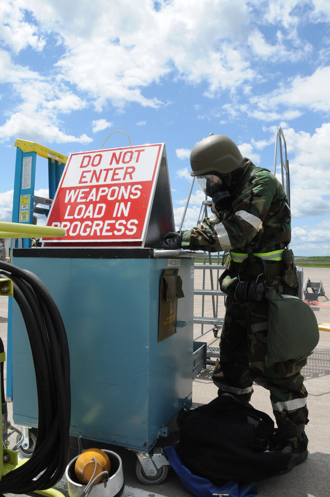 Senior Airman Jordan Richards is performing a Custom Tool Kit inventory following a successful weapons loading operation during the Operational Readiness Exercise June 11, 2011.  The exercise was designed to refamiliarize Airmen with Force Protection Conditions, Mission Oriented Protection Postures and for members to perform the mission while wearing the Chemical Protective Overgarment. (U.S. Air Force photo by Senior Airman Sarah Hayes.)
