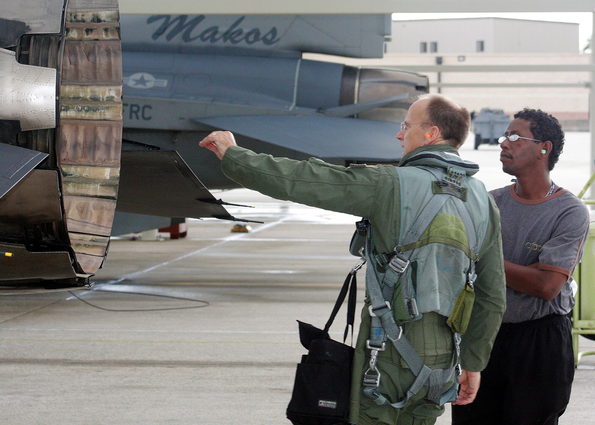 Col. Donald Lindberg, 482nd Fighter Wing commander and Mr. Willie Eutsey, a 482nd Force Support Squadron civilian,  conduct pre-flight inspections on an F-16 Fighting Falcon at Homestead Air Reserve Base, June 28, 2011. Mr. Eutsey is July's Mako Maintainer. The Mako Maintainer program gives Homestead ARB civilians who would not normally  see flightline activity a chance to work with a crew chief to prepare a jet for launch. The program serves to instill in members that they are part of the team, and reward them for outstanding job performance. Mr. Eutsey works at the Falcon's Nest Club on base. While departing the flightline, he smiled and said "I want one, I want to fly one." (US Air Force photo/Mr. Ian Carrier)