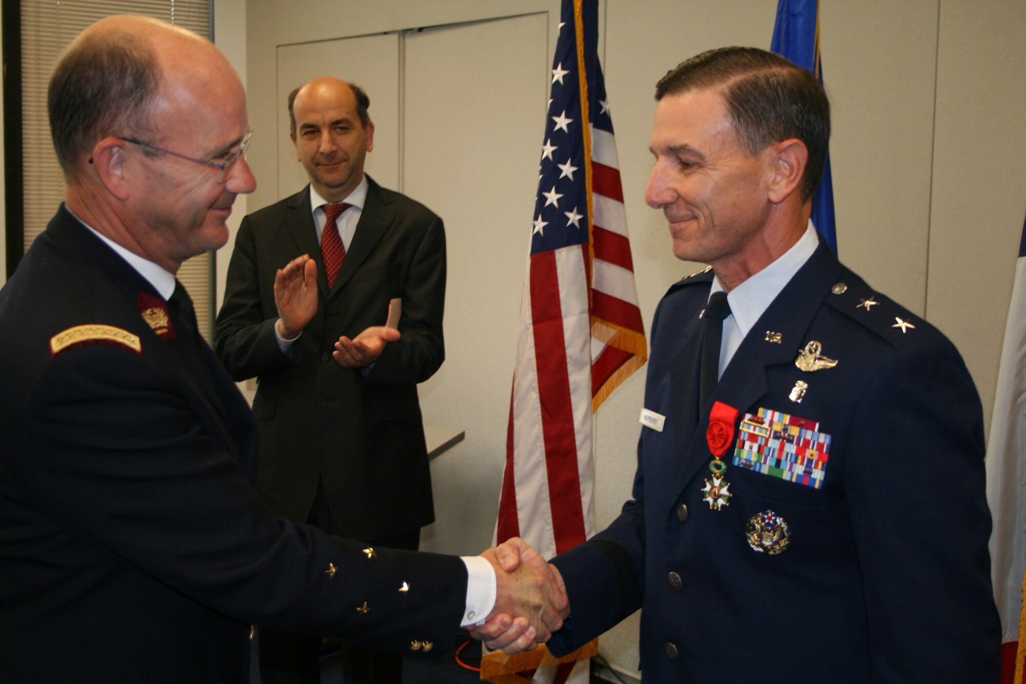 French Lt. Gen. G?rard Nedellec (left) shakes hands with Maj. Gen. (Dr.) Byron L. Hepburn, after pinning on the French Legion of Honor during a ceremony at the French Embassy in Washington June 21. General Nedellec is the French Armed Forces Surgeon General and commander of the French Military Health Service. General Hepburn is the commander of the 59th Medical Wing in San Antonio.  (U.S. Air Force photo)